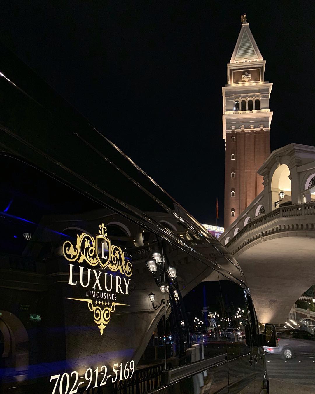 Luxury Limousines branded limo outside the Venetian casino Las Vegas at night concert event transportation