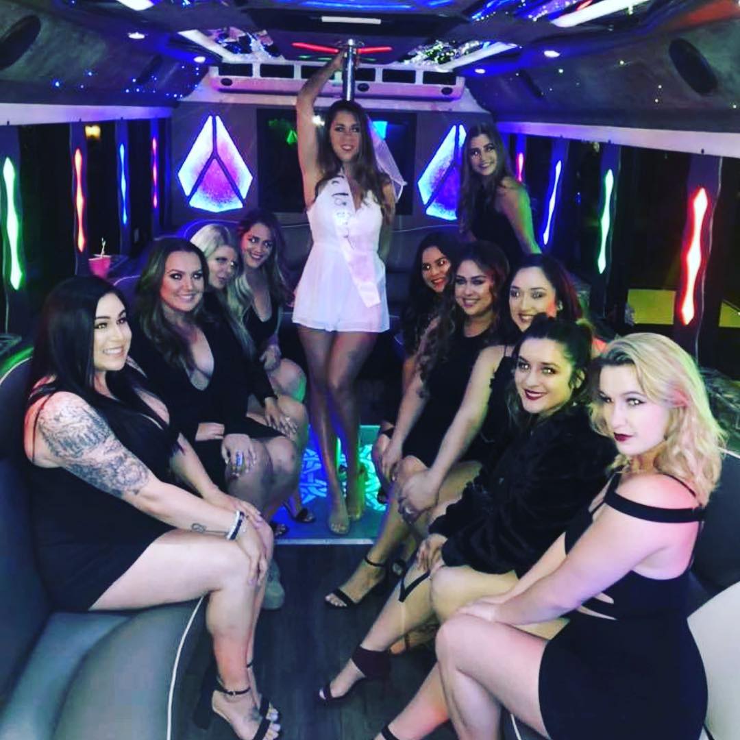 Bachelorette party inside luxury limo with pink and purple LED lighting Las Vegas girls night out