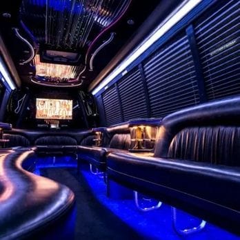 Luxury limousine party bus interior with blue ambient lighting